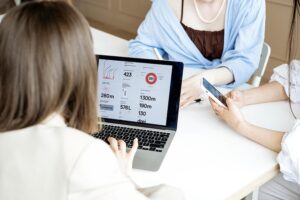 Woman meeting with supportive business professionals.