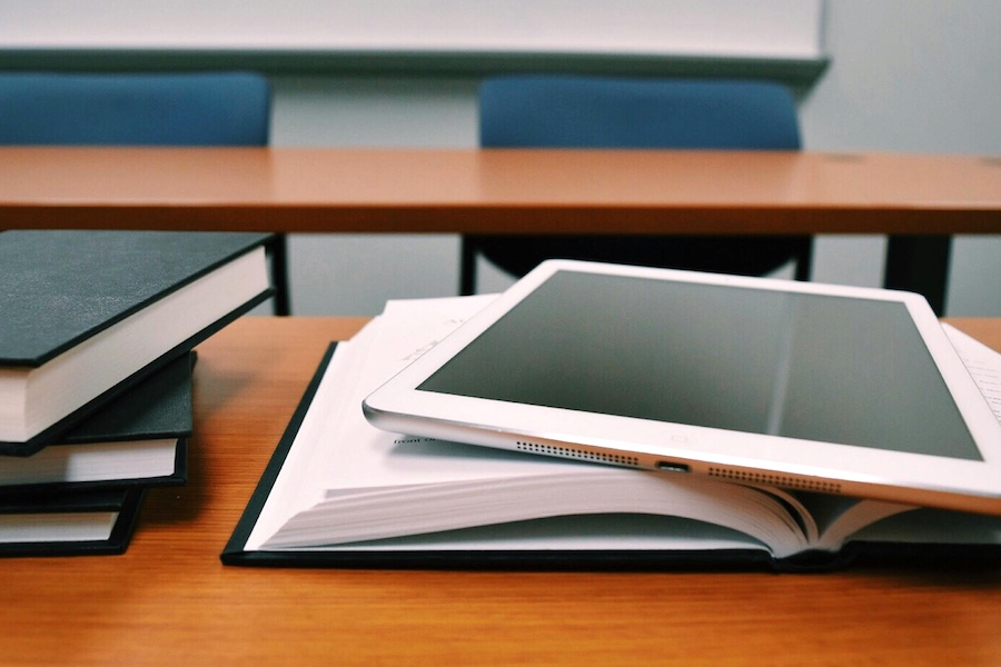 Notebook and tablet in a classroom.