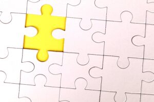 A yellow puzzle piece demonstrating how you can stand out as a candidate.