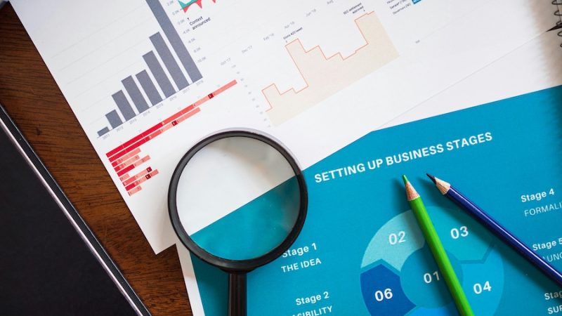 Planning tools and business reports on a tabletop.