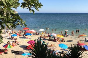 A crowded beach on a summer day.